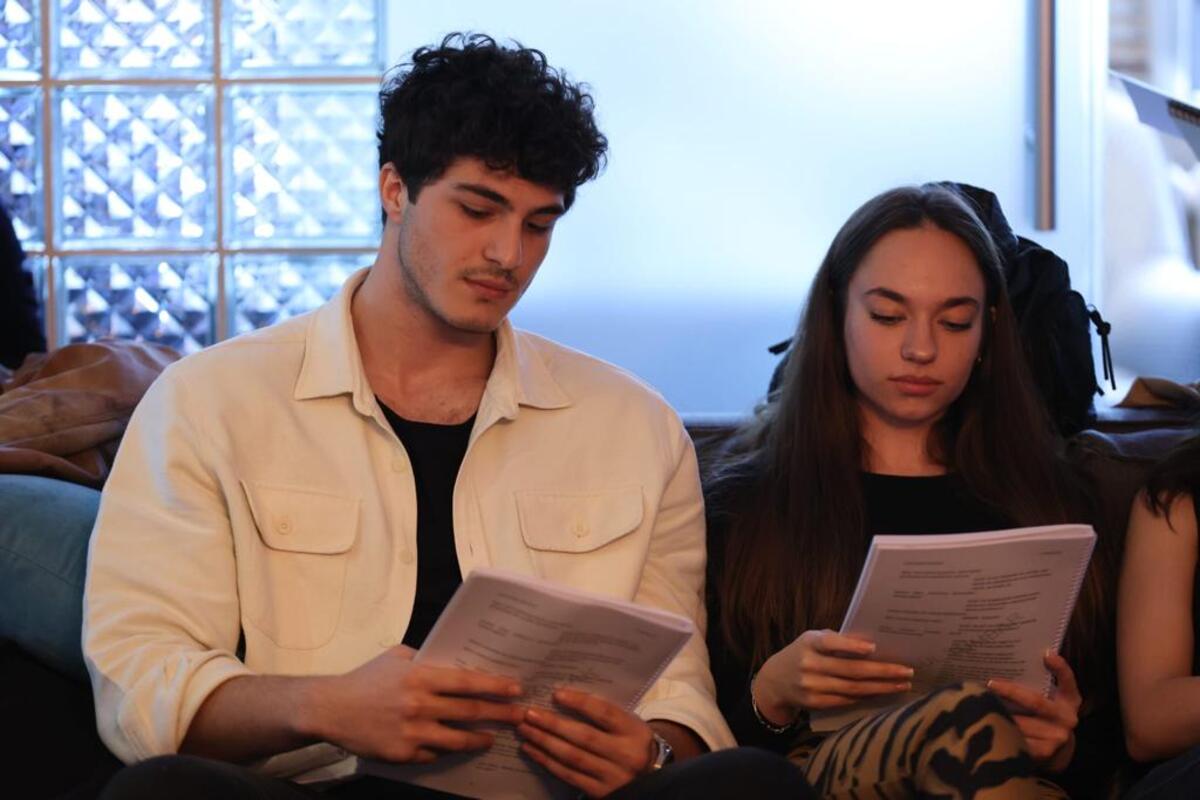 Eylül Tumbar and Enes Koçak reading the script